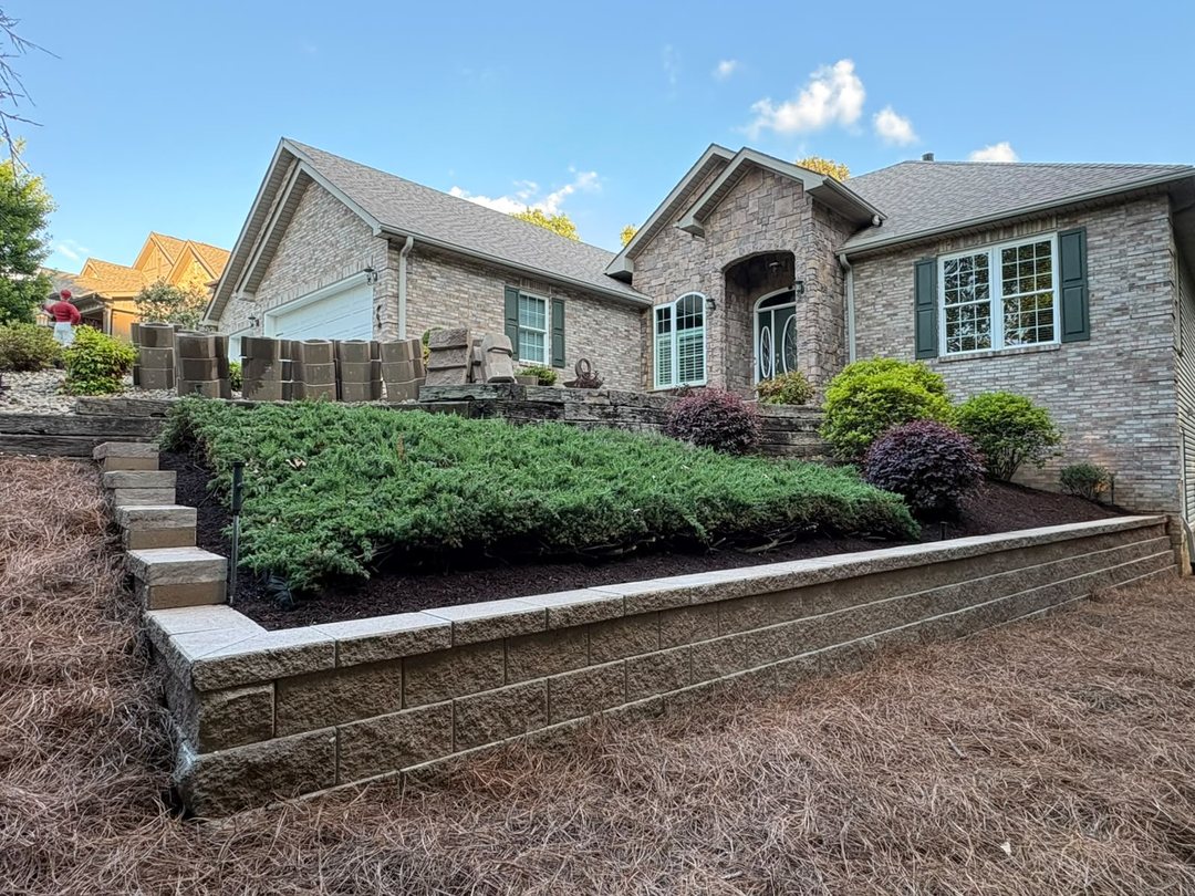 Block retaining wall with steps and plantings